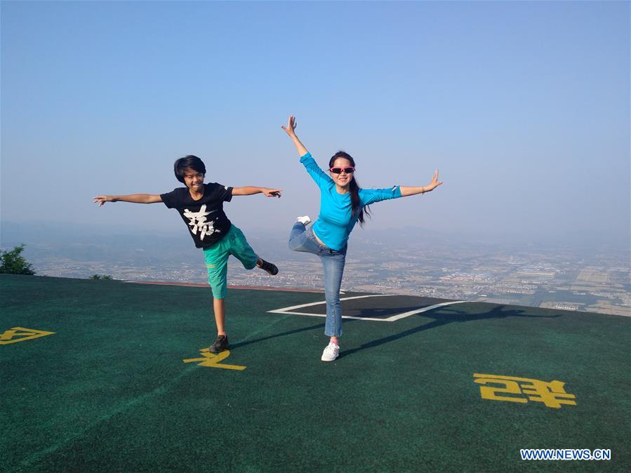 Xinhua Headlines: A Chinese mountaineer conquers the heights from rock bottom